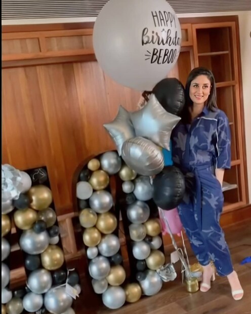  സിംപിൾ പ്ലെയിൻ ഗ്രീൻ ഫ്ളോറൽ വസ്ത്രം ധരിച്ച് കേക്കിന് മുന്നിൽ നിൽക്കുന്ന കരീനയുടെ ചിത്രം കരിഷ്മ കപൂർ ഇൻസ്റ്റഗ്രാമിലൂടെ പങ്കുവെച്ചു. (Image: Instagram)