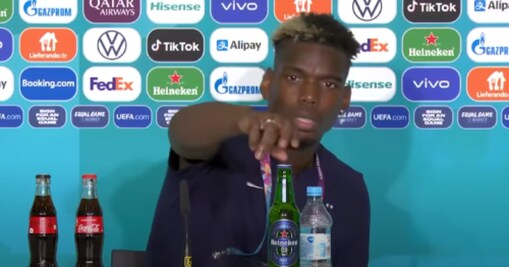Paul Pogba removing alcohol brand placed infront of him