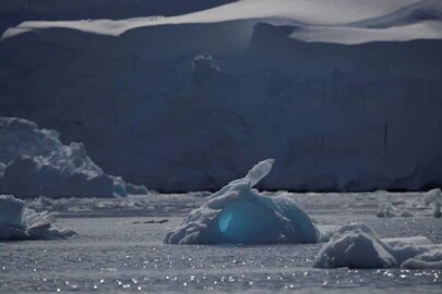 An iceberg floats along the water, close to Fournier Bay, Antarctica. (Credit: REUTERS/Ueslei Marcelino)
