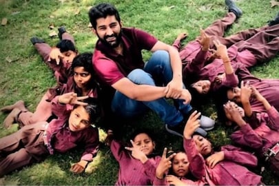 Jai Sharma with children. (Credit: Facebook/JOY)
