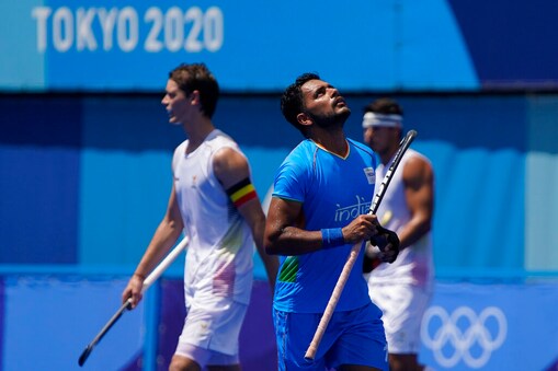 India's Harmanpreet Singh reacts after scoring during a men's field hockey semi-final match against Belgium at the 2020 Summer Olympics, Tuesday, Aug. 3, 2021, in Tokyo, Japan. (AP Photo/John Locher)