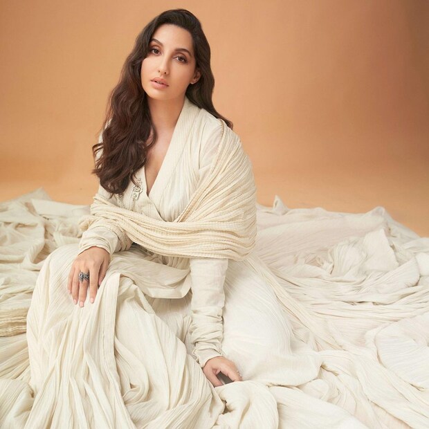 Nora Fatehi keeps it graceful in the white anarkali suit. 