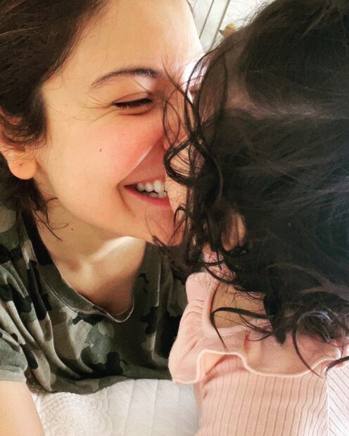 Anushka Sharma in a candid moment with daughter Vamika. 