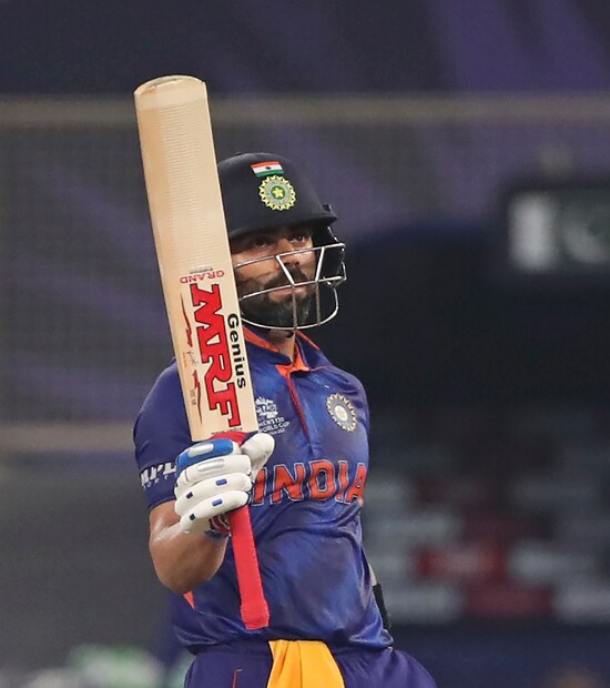 virat kohli raises bat after hitting half-century