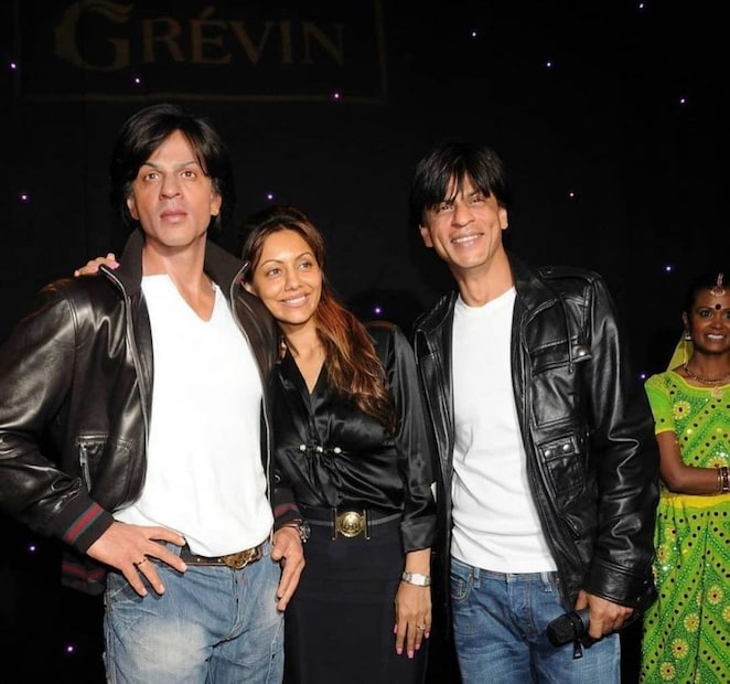 Gauri Khan with Shah Rukh Khan's wax statue. 