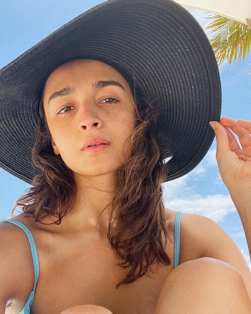 Alia Bhatt soaks up some vitamin D in her wide-brimmed hat. 