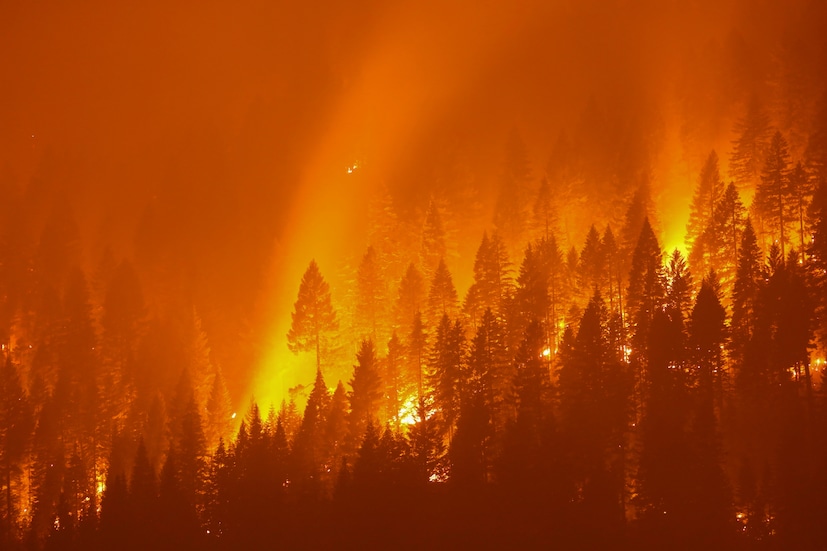 The Dixie Fire, now over 200,000 acres, burns at night in Taylorsville, California, U.S., on July 27. (Image: REUTERS/David Swanson)
