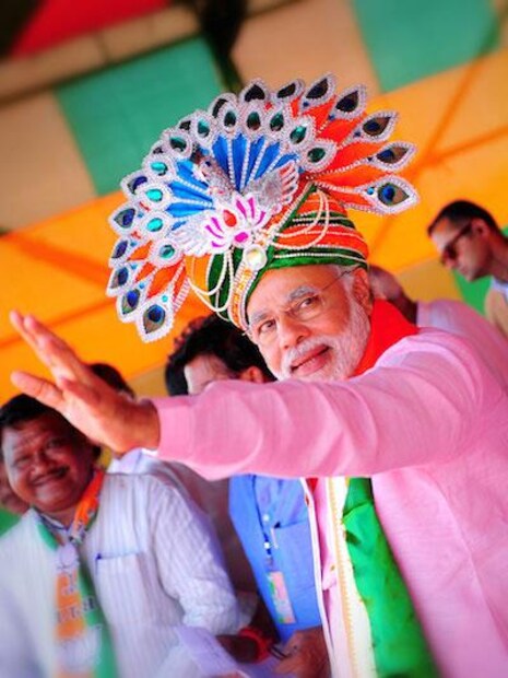Prime Minister Narendra Modi wears a turban with peacock-shaped silver jewellery on the top, at a rally in Rourkela in 2014. (Image: Twitter/@narendramodi)