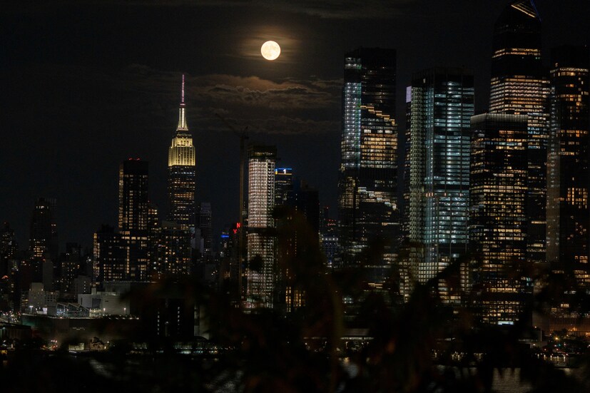 NEW YORK CITY, US: A full moon rises over the New York City skyline, as seen from Weehawken, New Jersey. Supermoon can have tidal effects on the planet. Therefore it causes very high and low tides. (Image: Reuters) 