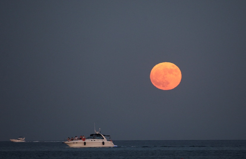 CYPRUS: A full moon known as the Buck Moon rises in Larnaca, Cyprus. (Image: Reuters) 