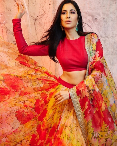 . In yet another lively Sabyasachi creation, the Dhoom 2 actress wore this lehenga set comprising a solid red full-sleeved blouse and contrasting yellow and red floral print lehenga. (Image: Instagram)