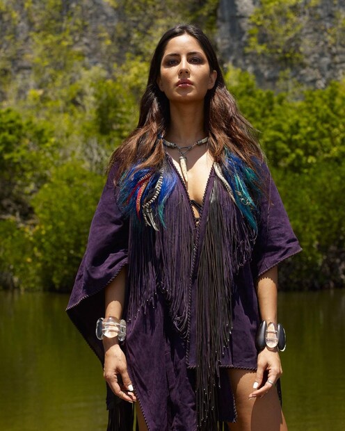 In this look, Katrina showed her Boho chic persona. The actress donned the black kaftan-Esque top featuring colourful features on the v-neck. Katrina finished the look with chunky handcuffs and a necklace. (Image: Instagram)