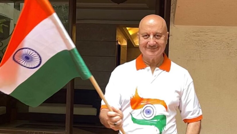 Anupam Kher wished the countrymen by sporting a tricolour tee while holding the national flag.