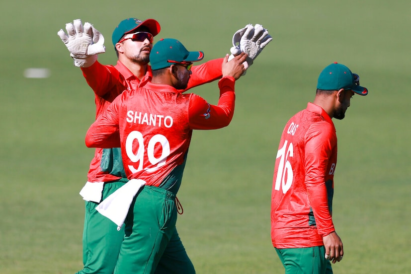 bangladesh players celebrate the fall of a wicket