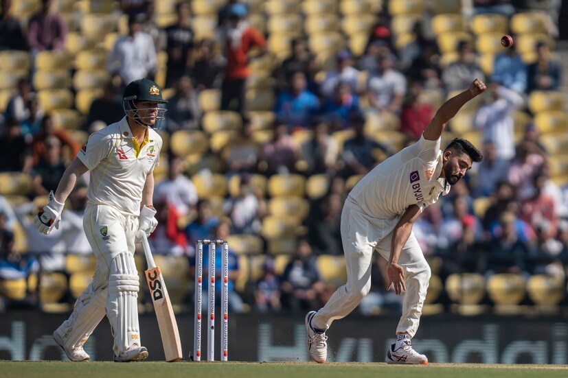 India's Mohammed Siraj, right, bowls as Australia's David Warner, left , looks on during the first day of the first cricket test match between India and Australia in Nagpur, India, Thursday, Feb. 9, 2023. (AP Photo)