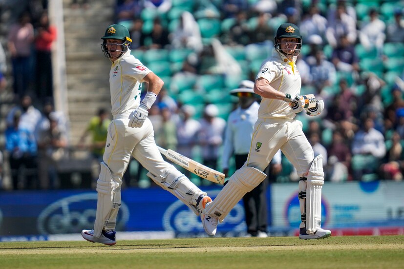 Australia's Steve Smith, left, along with Australia's Marnus Labuschagne runs between the wickets during the first day of the first cricket test match between India and Australia in Nagpur, India, Thursday, Feb. 9, 2023. (AP Photo)