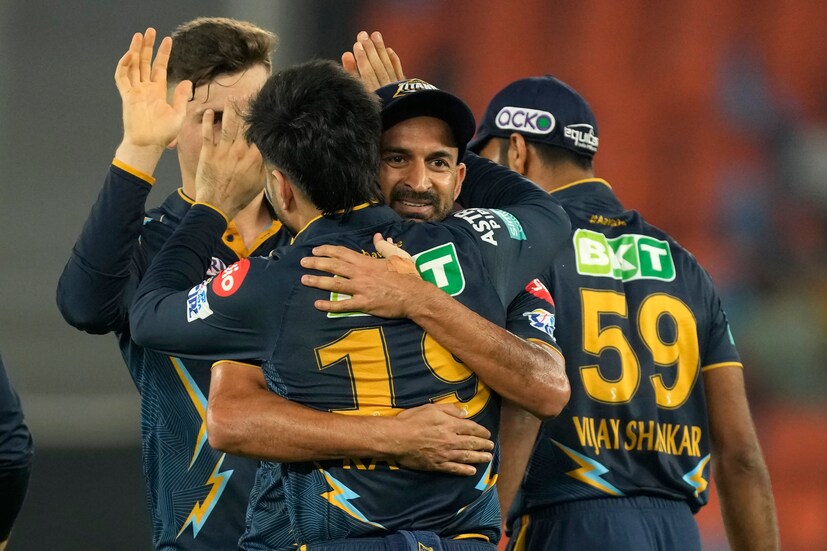 Gujarat Titans' Mohit Sharma, facing camera, celebrates with teammates after the dismissal of Delhi Capitals' Axar Patel during the Indian Premier League cricket match between Gujarat Titans and Delhi Capitals in Ahmedabad, India, Tuesday, May 2, 2023. (AP Photo)