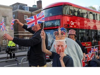 Well-wishers gather along the path that Britain's King Charles and Queen Consort Camilla will travel during the procession marking their coronation along the main streets of London, Britain, May 5, 2023. REUTERS/Violeta Santos Moura