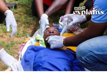 Members of the Kenya Red Cross attend to an emaciated member of a Christian cult named as Good News International Church. Reuters/Stringer