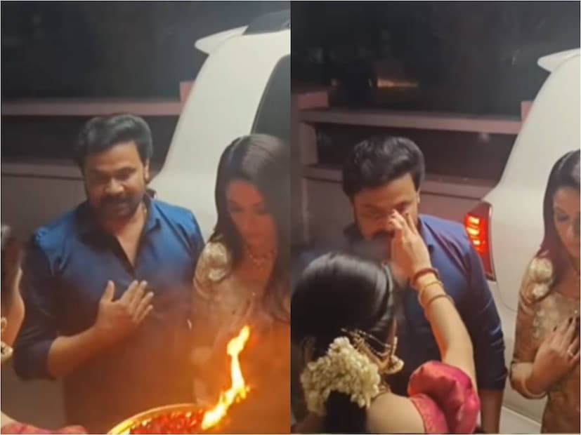 ഇത്തവണയും കാവ്യാ മാധവൻ ധരിച്ചിട്ടുള്ളത് അവരുടെ സ്വന്തം ബ്രാൻഡായ ലക്ഷ്യയുടെ വേഷമാണ്. ദിലീപിനെയും കാവ്യാ മാധവനെയും കുറിതൊട്ട് ആരതി ഉഴിഞ്ഞ് അകത്തേക്ക് കയറ്റുന്ന വീഡിയോ ദൃശ്യത്തിലെ മറ്റു രണ്ടുപേരെയും പ്രേക്ഷകർക്ക് പരിചയമുണ്ട്. നടി നിരഞ്ജന അനൂപും അമ്മ നാരായണി അനൂപുമാണ് ഇതിലുള്ളത്. ഇവരുമായി ബന്ധമുള്ള ഒരു ചടങ്ങിലാണ് താരദമ്പതികൾ എത്തിച്ചേർന്നിട്ടുള്ളത് (തുടർന്ന് വായിക്കുക)
