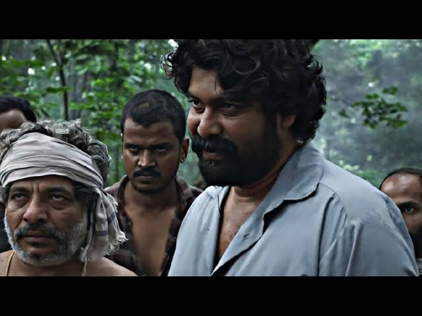 ഒളിവിൽ കഴിയുന്ന ഒരു കുറ്റവാളിയെ തിരഞ്ഞതിന് ശേഷം ചുരുളി ഗ്രാമത്തിൽ കുടുങ്ങിക്കിടക്കുന്ന രണ്ട് രഹസ്യ പോലീസ് ഉദ്യോഗസ്ഥരുടെ കഥയാണ് 'ചുരുളി' പറയുന്നത്
