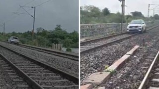 റെയില്‍വേ ജീവനക്കാര്‍ തടയാന്‍ ശ്രമിച്ചെങ്കിലും യുവതി കാര്‍ നിര്‍ത്തിയില്ല