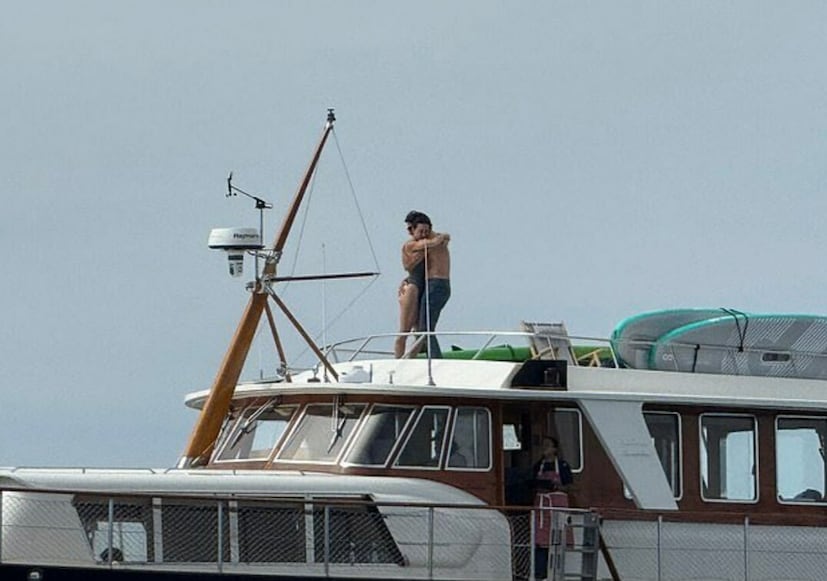 Photos obtained by The Daily Mail show the singer in a black swimsuit, embracing a shirtless Trudeau, who was seen in denim jeans. 