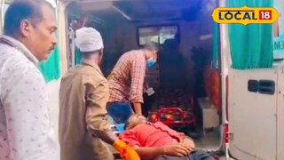 തളർന്നു വീണ യുവാവിനെ ആശുപത്രിയിലേക്ക് കൊണ്ടുപോകുന്നു 