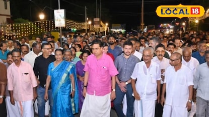 നവീകരിച്ച എം ജി റോഡിലൂടെ സ്പീക്കർ ഷംസീറും ജനപ്രതിനിധികളും നടക്കുന്നു 