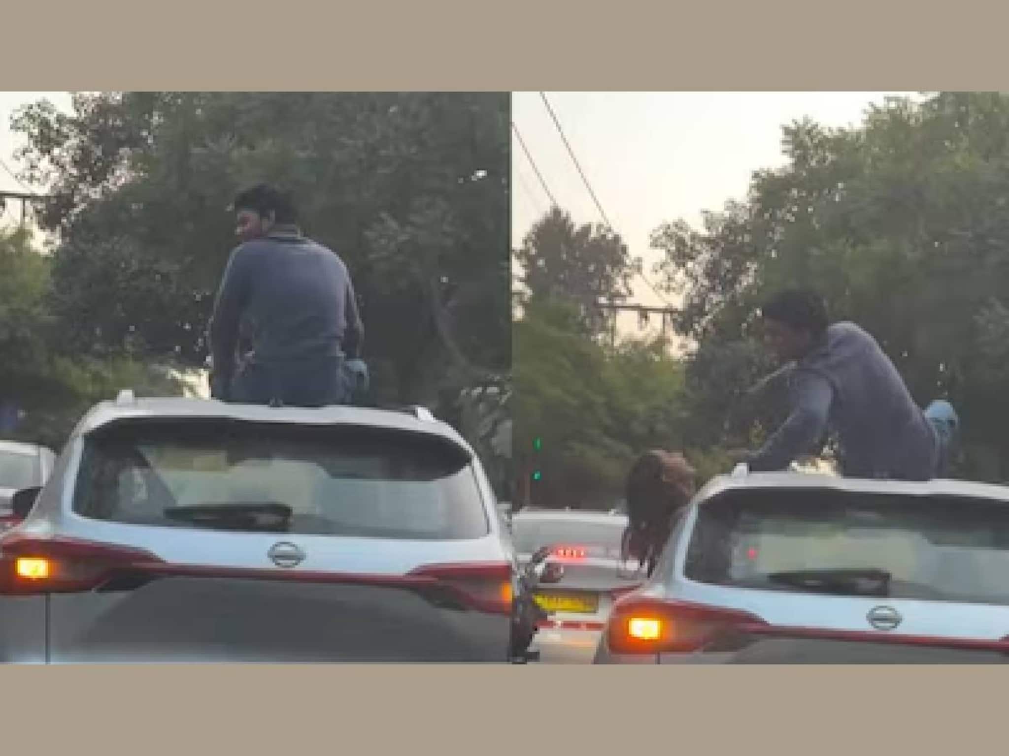 കാറിന്റെ റൂഫിൽ ചാടിക്കയറുന്നു, കാമുകിയെ ചുംബിക്കുന്നു; യുവാവിന്റെ 'പ്രകടനം' വൈറൽ കാറിന്റെ റൂഫിൽ ചാടിക്കയറുന്നു, കാമുകിയെ ചുംബിക്കുന്നു; യുവാവിന്റെ 'പ്രകടനം' വൈറൽ