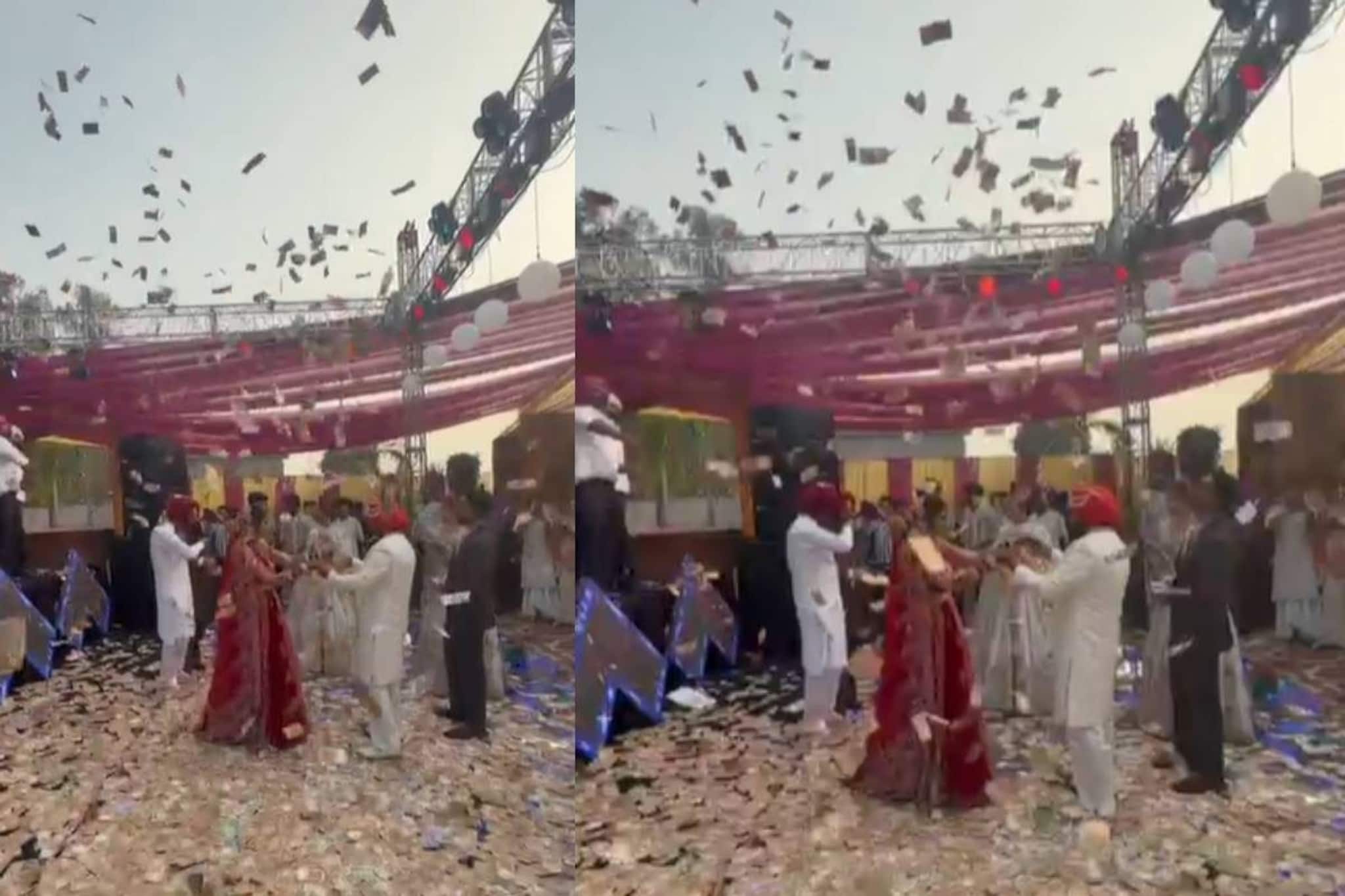 നവദമ്പതികളുടെ മേൽ മഴയായ് പെയ്തത് ലക്ഷങ്ങളുടെ നോട്ടുകൾ; പഞ്ചാബി വിവാഹ വീഡിയോ വൈറൽ