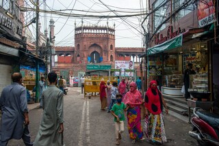 Women walking in bazar matia mahal near jama masjid in old delhi. Copyright (c) 2021 PradeepGaurs/Shutterstock.