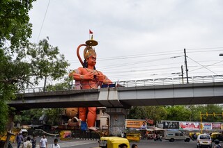 Big statue of Lord Hanuman near the delhi metro bridge situated near Karol Bagh, Delhi, India, Lord Hanuman big statue touching sky. Copyright (c) 2023 Rahul Sapra/Shutterstock.