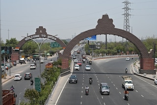 Image of the road from top angle Kalindi Kunj Road, Noida, near Okhla Bird Sanctuary in Delhi, India. Copyright (c) 2024 Meenakshi_Vashistha/Shutterstock.