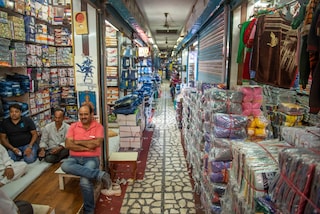 Shopkeeper waiting for customers at Gandhi Nagar Market, Asia biggest readymade garments and textile market  in New Delhi, India.. Gandhi nagar has many shops and factories. Copyright (c) 2021 PradeepGaurs/Shutterstock.