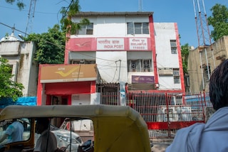 Indian Post office building in Seelampur Delhi, The Indian postal system has 150,000 post offices and provides the most widely distributed postal service in the world. Copyright (c) 2021 PradeepGaurs/Shutterstock.