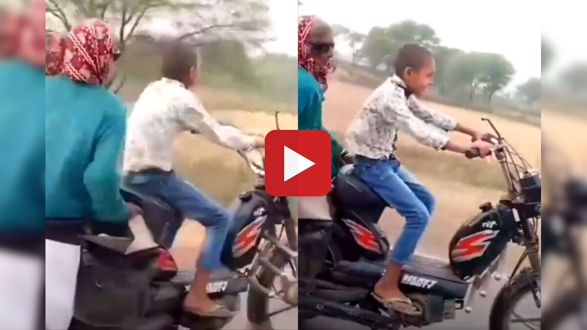 small boy driving bike