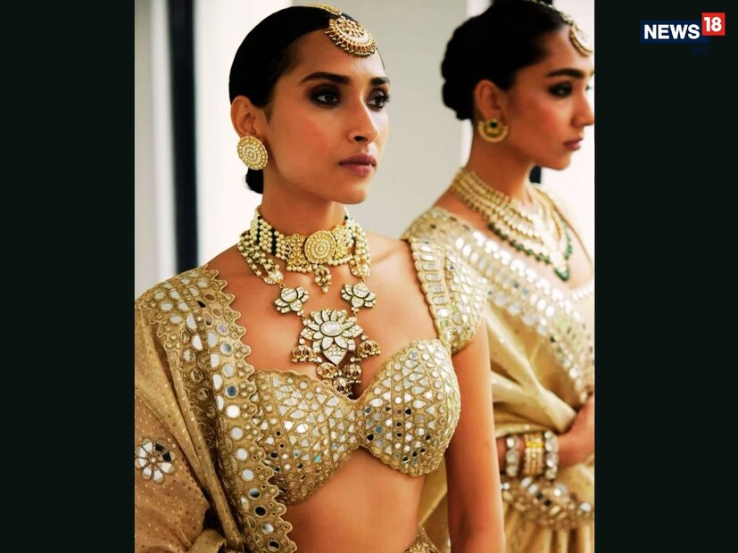 मिरर वर्क ब्लाउज - एक हंगामी फॅशन : मिरर वर्क नेहमीच वधूच्या फॅशनचा आवडता भाग राहिला आहे. चमकणाऱ्या आरशांसह रंगीत भरतकाम या ब्लाउजला उत्सवपूर्ण आणि चमकदार लूक देते. पेस्टल किंवा ब्राइट लेहेंगासह हा लूक दिवसा आणि रात्री दोन्ही वेळी आकर्षक दिसतो. स्टेज लाईट्समध्ये त्याची चमक वधूला आणखी शाही लूक देते.