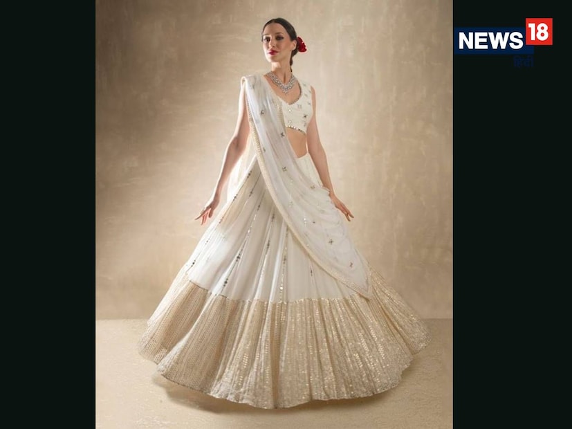 घेर असलेला लेहेंगा (Circular Lehenga) : तुम्हाला पारंपरिक लूक हवा असेल, तर ही डिझाईन तुमच्यासाठी सर्वोत्तम आहे. याचा मोठा गोल घेर फिरताना खूप सुंदर दिसतो. लाल किंवा मरून रंगाव्यतिरिक्त हलक्या रंगांमध्येही हा डिझाईन नववधूला रॉयल टच देतो.