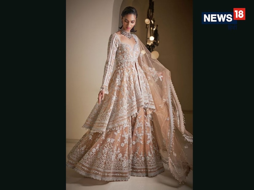 शरारा स्टाईल लेहेंगा (Sharara Style Lehenga) : हे डिझाईन पारंपरिक आणि रॉयल अशा दोन्ही प्रकारचा फील देते. यात लेहेंगा रुंद पॅन्ट सारखा असतो, जो शरारा स्टाईलमध्ये घेर देतो. उत्तर प्रदेश आणि लखनऊची झलक या डिझाईनमध्ये स्पष्टपणे दिसते.
