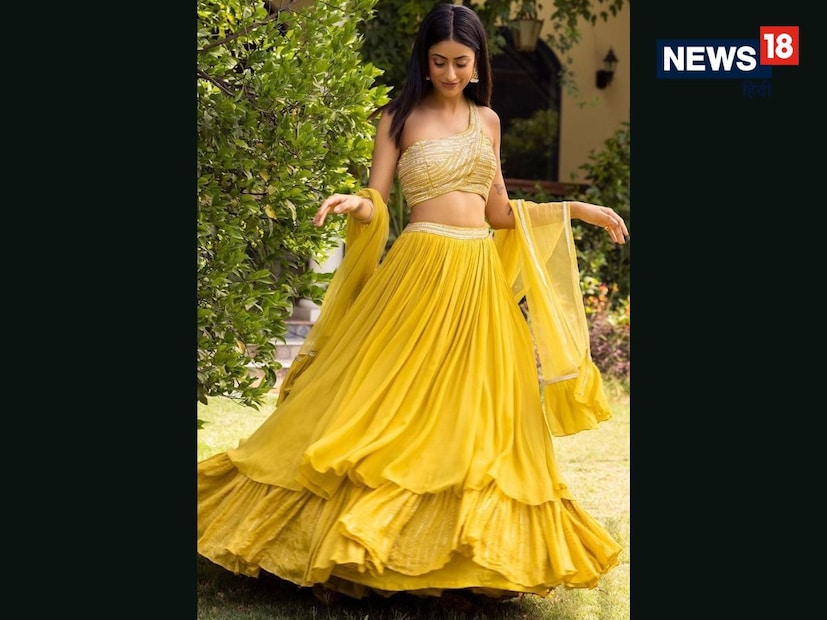 लेयर्ड लेहेंगा डिझाईन (Layered Lehenga) : या लेहेंग्यात दोन किंवा तीन लेअर्स असतात, जे हालचाल करताना एक सुंदर इफेक्ट देतात. ही डिझाईन वजनाने हलकी असूनही ग्रँड फील देते, खासकरून प्री-वेडिंग किंवा मेहंदी समारंभासाठी.