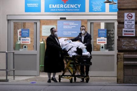 A man is wheeled on a stretcher at Maimonides Medical Center during the outbreak of the coronavirus disease (COVID19) in the Brooklyn borough of New York, US. (Reuters)