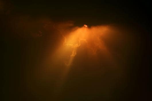 FILE PHOTO: The sun struggles through the clouds as high winds push smoke and ash from the Currowan Fire towards Nowra, New South Wales, Australia January 4, 2020. REUTERS/Tracey Nearmy/File Photo

