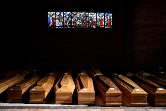 Coffins of people who have died from coronavirus disease (COVID-19) are seen in the church of the Serravalle Scrivia cemetery, which like many places in northern Italy is struggling to cope with the number of deaths from the virus that is growing every day, in Alessandria, Italy, March 23, 2020. REUTERS/Flavio Lo Scalzo TPX IMAGES OF THE DAY Coffins of people who have died from coronavirus disease (COVID-19) are seen in the church of the Serravalle Scrivia cemetery, which like many places in northern Italy is struggling to cope with the number of deaths from the virus that is growing every day, in Alessandria, Italy, March 23, 2020. REUTERS/Flavio Lo Scalzo TPX IMAGES OF THE DAY