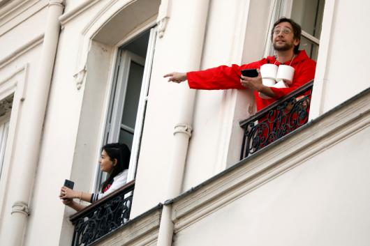 Noam Cartozo, a Parisian comedian, hosts a daily quiz 'Questions for a Balcony' with his neighbours from his balcony in Paris. Picture taken April 8, 2020. REUTERS/Charles Platiau
Noam Cartozo, a Parisian comedian, hosts a daily quiz 'Questions for a Balcony' with his neighbours from his balcony in Paris. Picture taken April 8, 2020. REUTERS/Charles Platiau