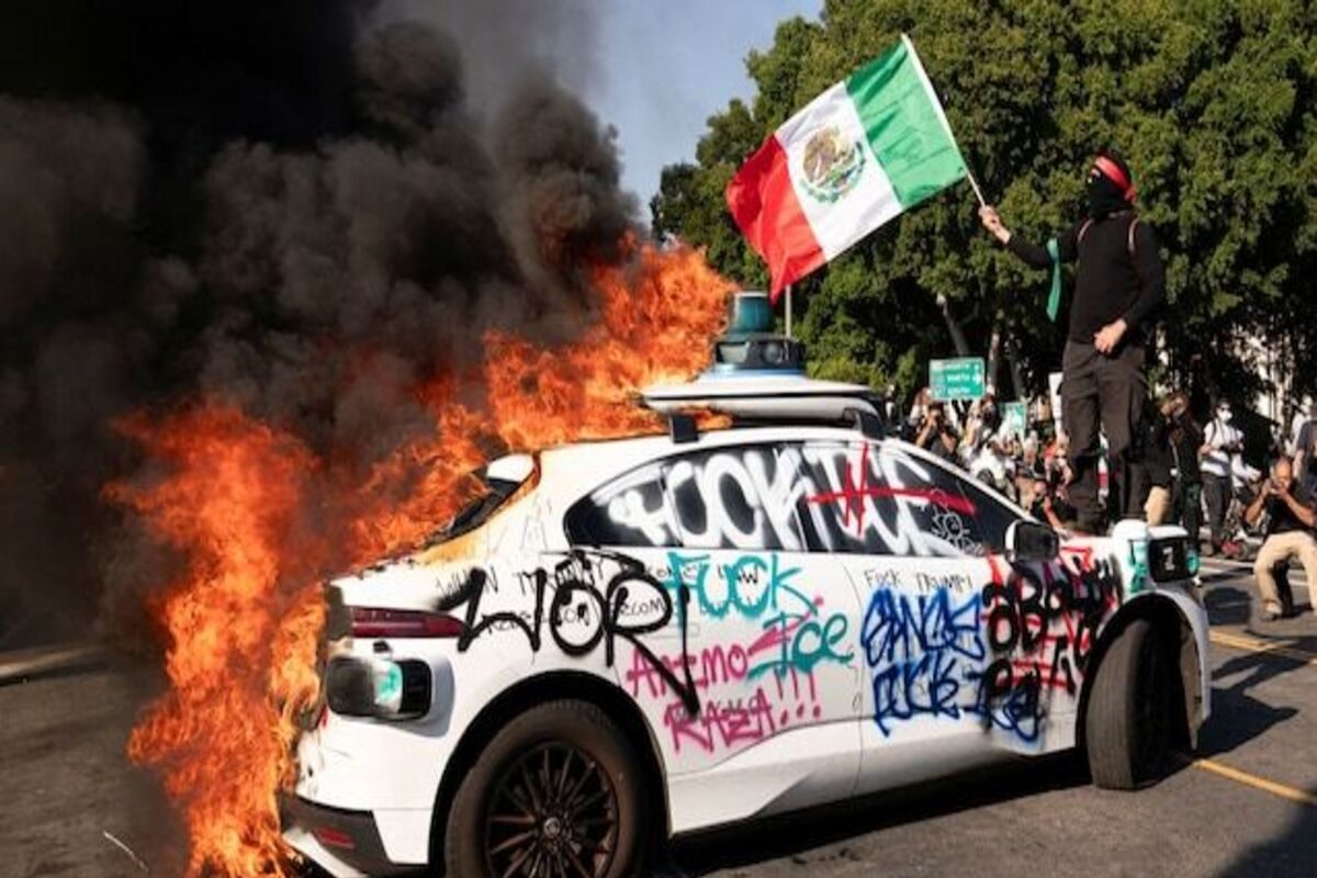A riot, burnt American flag waved on the Los Angeles in the United States A riot, burnt American flag waved on the Los Angeles in the United States