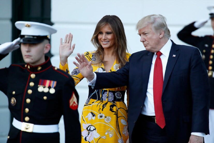 President Donald Trump waves, with first lady Melania Trump, as Indian Prime Minister Narendra Modi departs the White House.