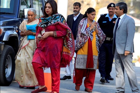 Former Indian navy officer Kulbhushan Jadhav's mother Avanti (L) and wife, Chetankul, (3rd R) arrive to meet him at Ministry of Foreign Affairs in Islamabad, Pakistan.