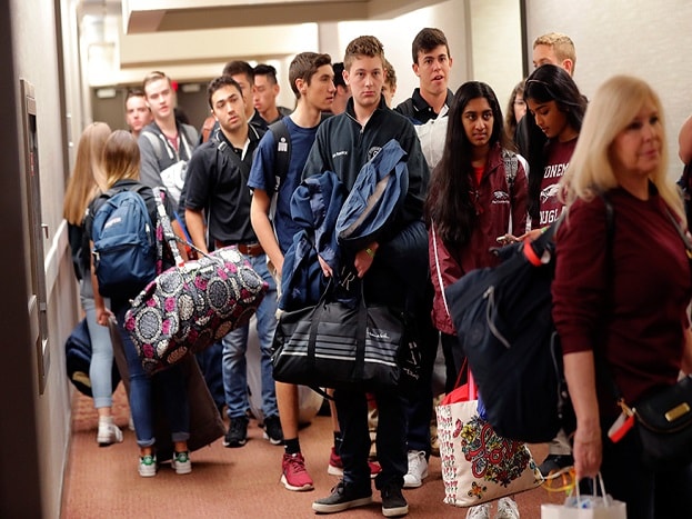 Student survivors from Marjory Stoneman Douglas High School prepare to load their bags on buses, after spending the night in the civic centre in Tallahassee. (Image: AP) Student survivors from Marjory Stoneman Douglas High School prepare to load their bags on buses, after spending the night in the civic centre in Tallahassee. (Image: AP)
