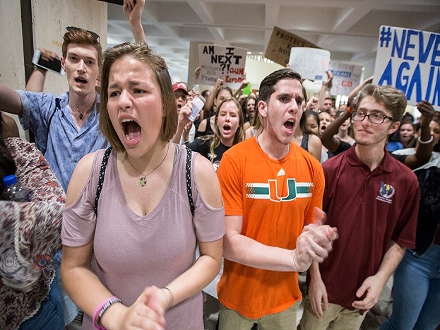 Students chant protest slogans outside the Florida House of Representatives chamber inside the Florida Capitol in Tallahassee. (Image: AP) Students chant protest slogans outside the Florida House of Representatives chamber inside the Florida Capitol in Tallahassee. (Image: AP)